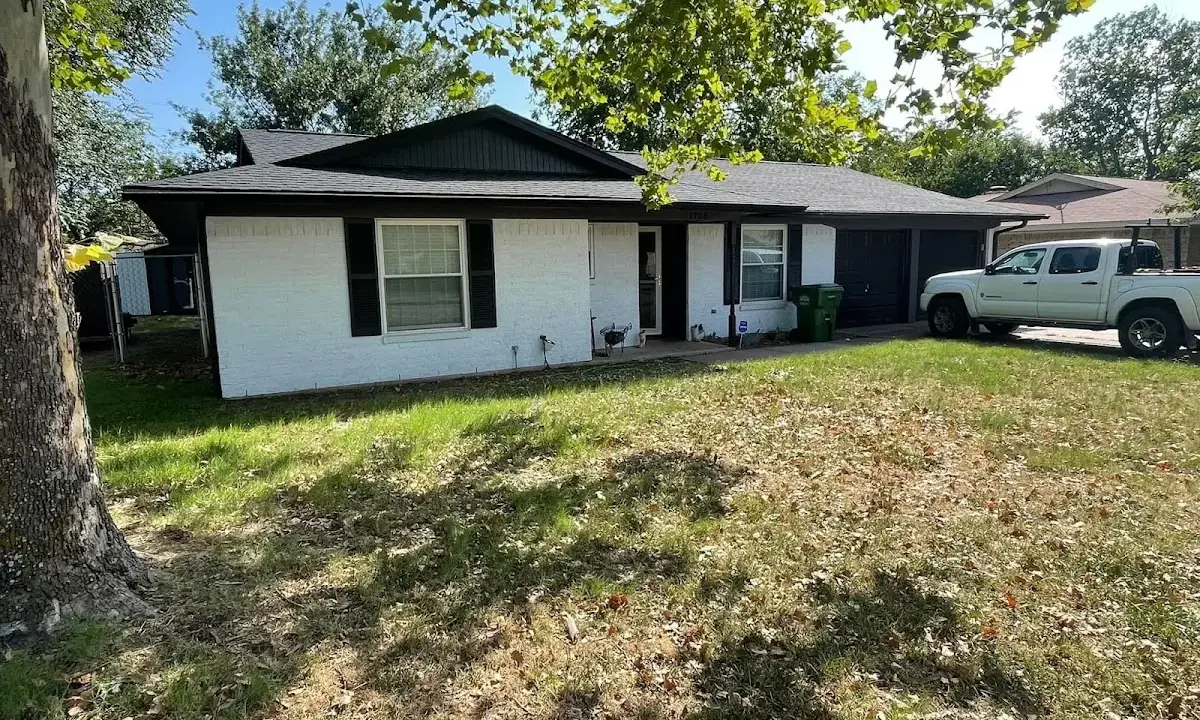 Professional roofing crew working on a residential roof in Southeast